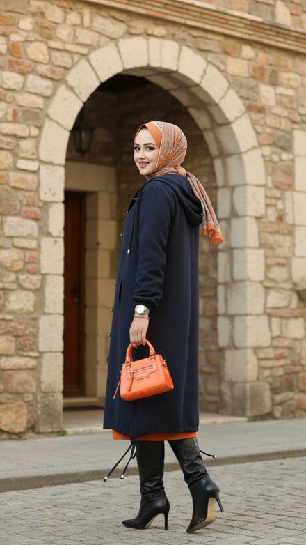 Layer up in our blue hijab winter outfit, a hooded Tivit Turkish winter style with buttons, pockets & rubberized cuffs. 